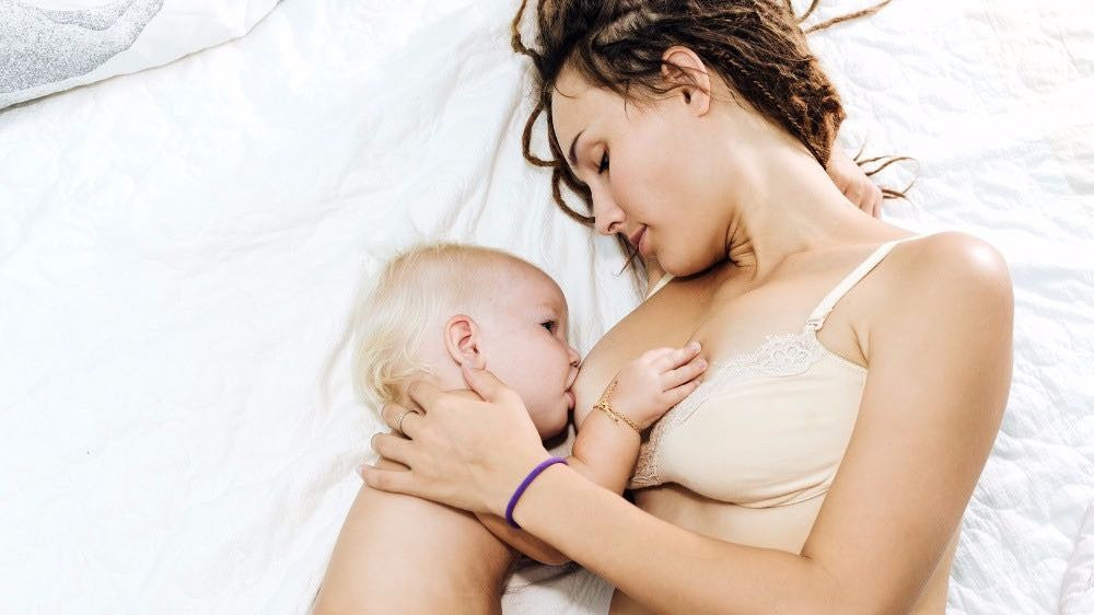 Why Your Baby Started Nursing All Night (And What To Do About It)