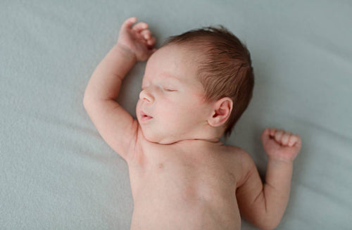 Baby Grunting in Sleep and Other Newborn Sleep Sounds, Explained